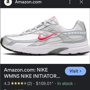 Nike Silver/ Red tennis shoes. Size 7.5 Worn one time. Excellent condition.